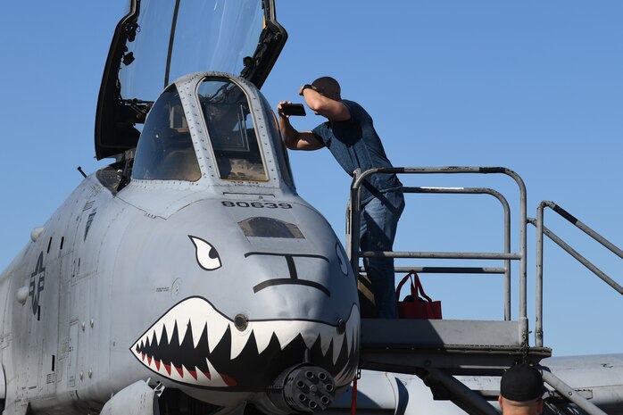 An Air Expo attendee tours an aircraft at the Titans of Flight Air Expo, Joint Base Charleston, South Carolina, April 10, 2022.