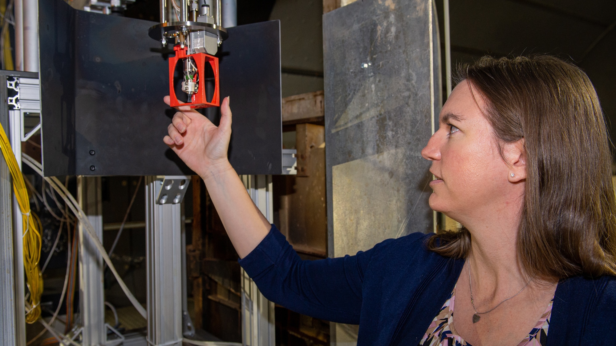 Corinne Sedano, group lead for Chemical Propulsion Flight Programs in the “In Space” Branch at AFRL’s Edwards AFB Rocket Lab facility, reviews AFRL’s test stand for One Newton Thrusters. The Chemical Propulsion Flight Programs Group has successfully completed the Advanced Spacecraft Energetic Non-toxic Propellant (ASCENT) monopropellant 1 Newton (1N) thruster testing in the Chemical in-Space Thruster Test and Research Site test facility. (U.S. Air Force photo/Josh McClanahan)