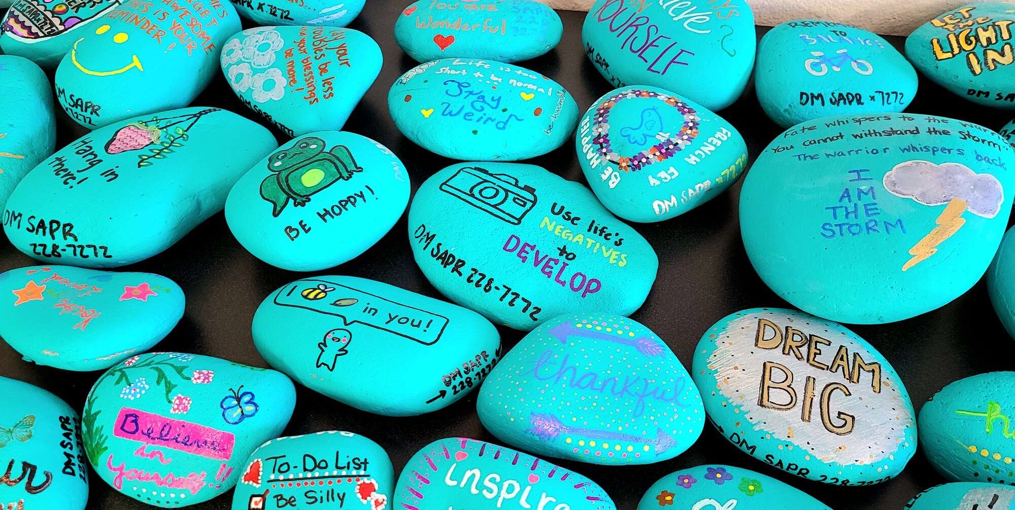 A photo of rocks with messages on them.