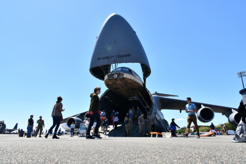 Attendees tour a C-5M Super Galaxy static display at the Titans of Flight Air Expo, Joint Base Charleston, South Carolina, April 8, 2022.