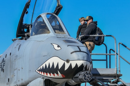 Attendees tour an A-10 Thunderbolt II static display at the Titans of Flight Air Expo, Joint Base Charleston, South Carolina, April 8, 2022.