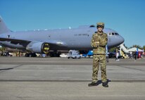 Colton Woody poses in front of a KC-46 Pegasus at the Titans of Flight Air Expo, Joint Base Charleston, South Carolina, April 10, 2022.