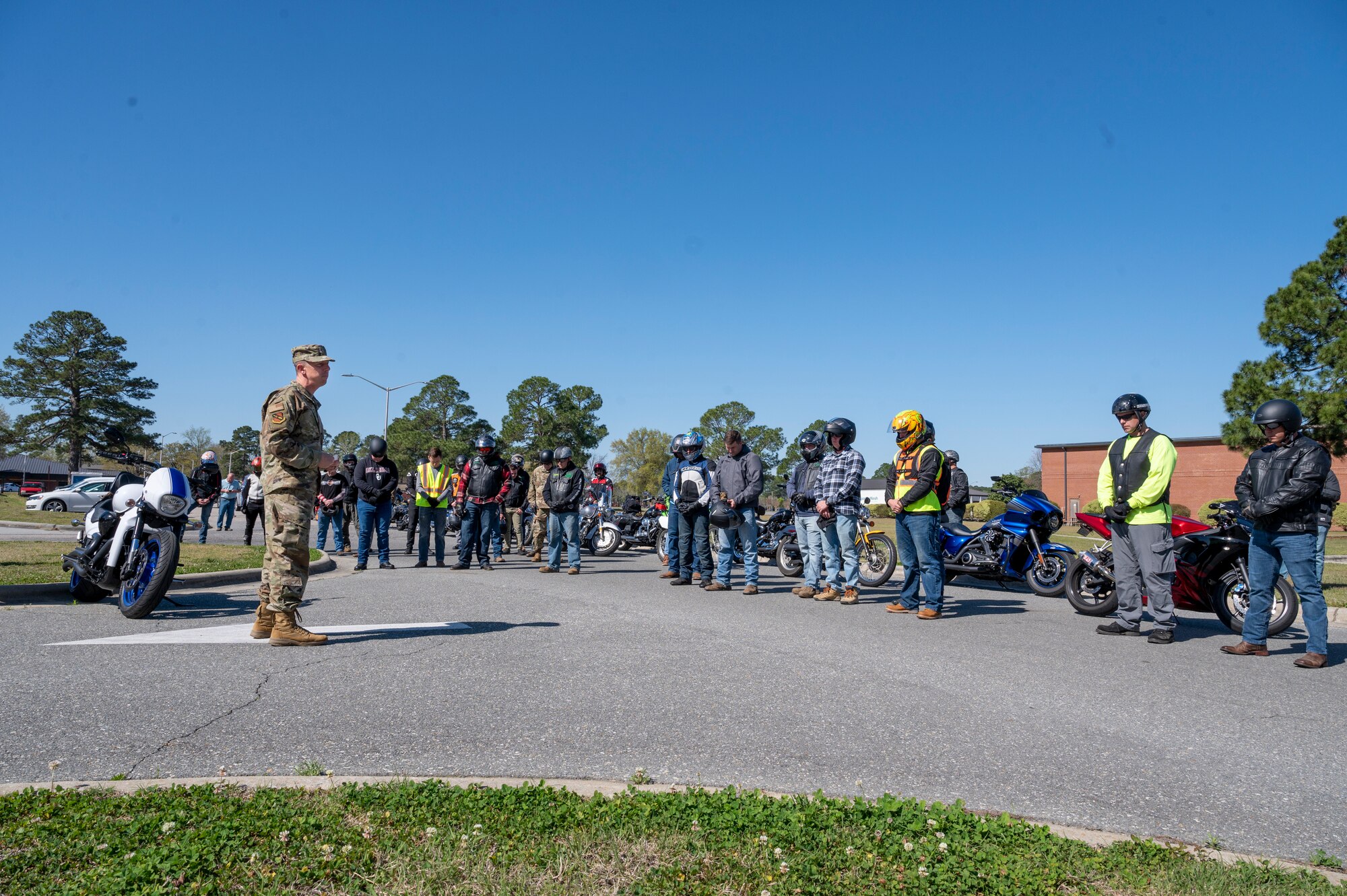 Chaplain (Capt.) David Shrader, 4th Fighter Wing, left, gives members assigned to the 4th Fighter Wing an invocation before their motorcycle mentorship ride at Seymour Johnson Air Force Base, North Carolina, April 1, 2022.