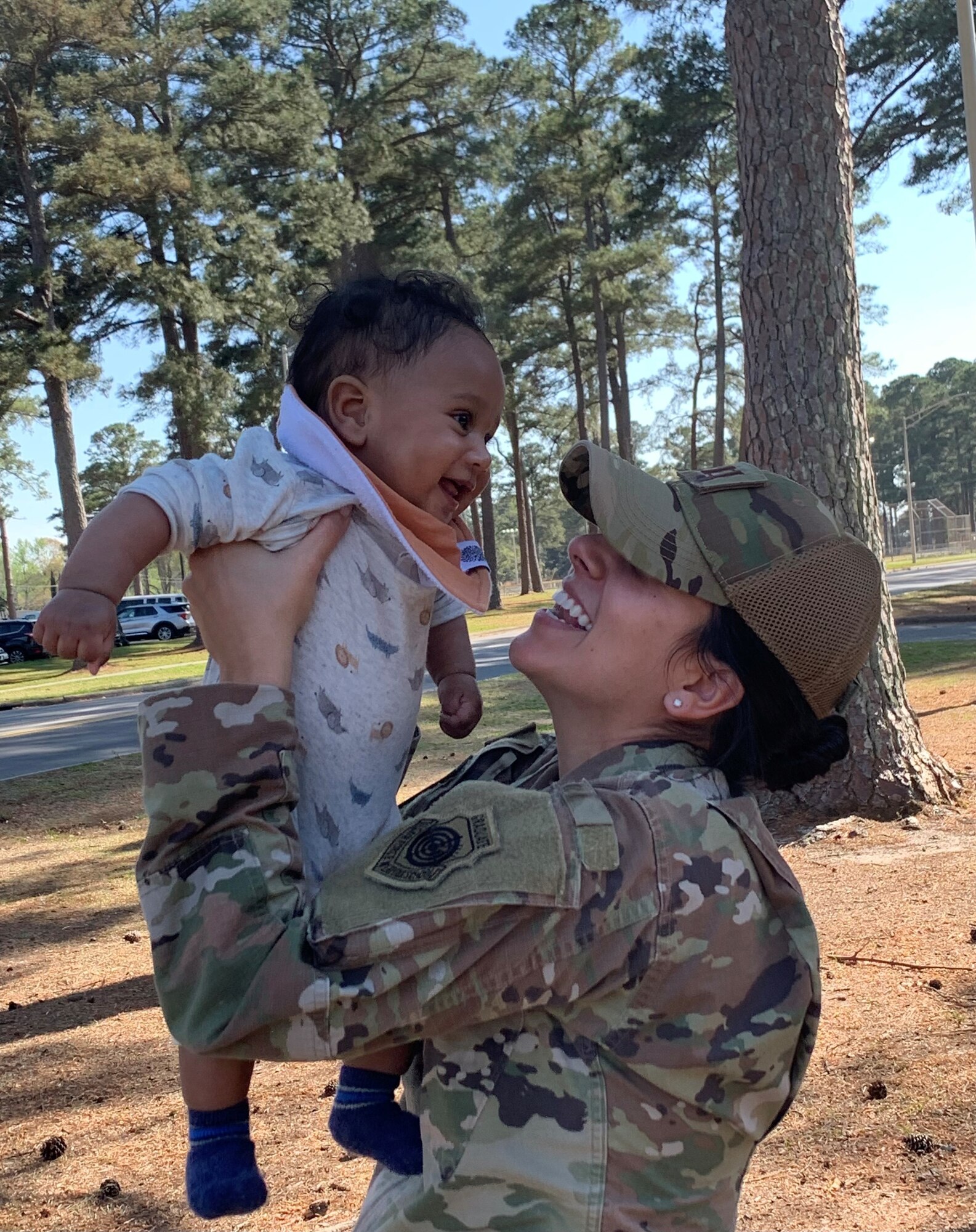 Capt. Stephannie Hernandez Ruberte, 4th Operations Support Squadron intelligence weapons officer, holds her son at Seymour Johnson Air Force Base, North Carolina, April 1, 2022.