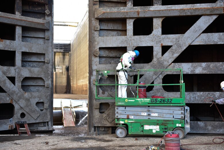 TVA paint crew inspects and removes any lead-based paint from the miter gates at Wilson Lock April 8, 2022, on the Tennessee River in Florence, Alabama.