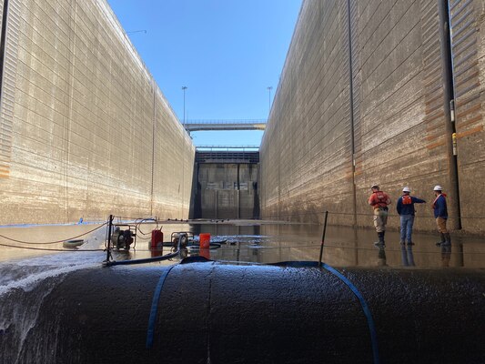 LRD Civil Engineer Jeff Ross, Chief, Light Fleet Jeff Neely, and Wilson Lock Lockmaster Clay Askew evaluate the floor of the main lock chamber of Wilson Lock on April 7, 2022.