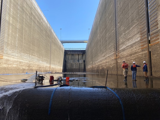 LRD Civil Engineer Jeff Ross, Chief, Light Fleet Jeff Neely, and Wilson Lock Lockmaster Clay Askew evaluate the floor of the main lock chamber of Wilson Lock on April 7, 2022.