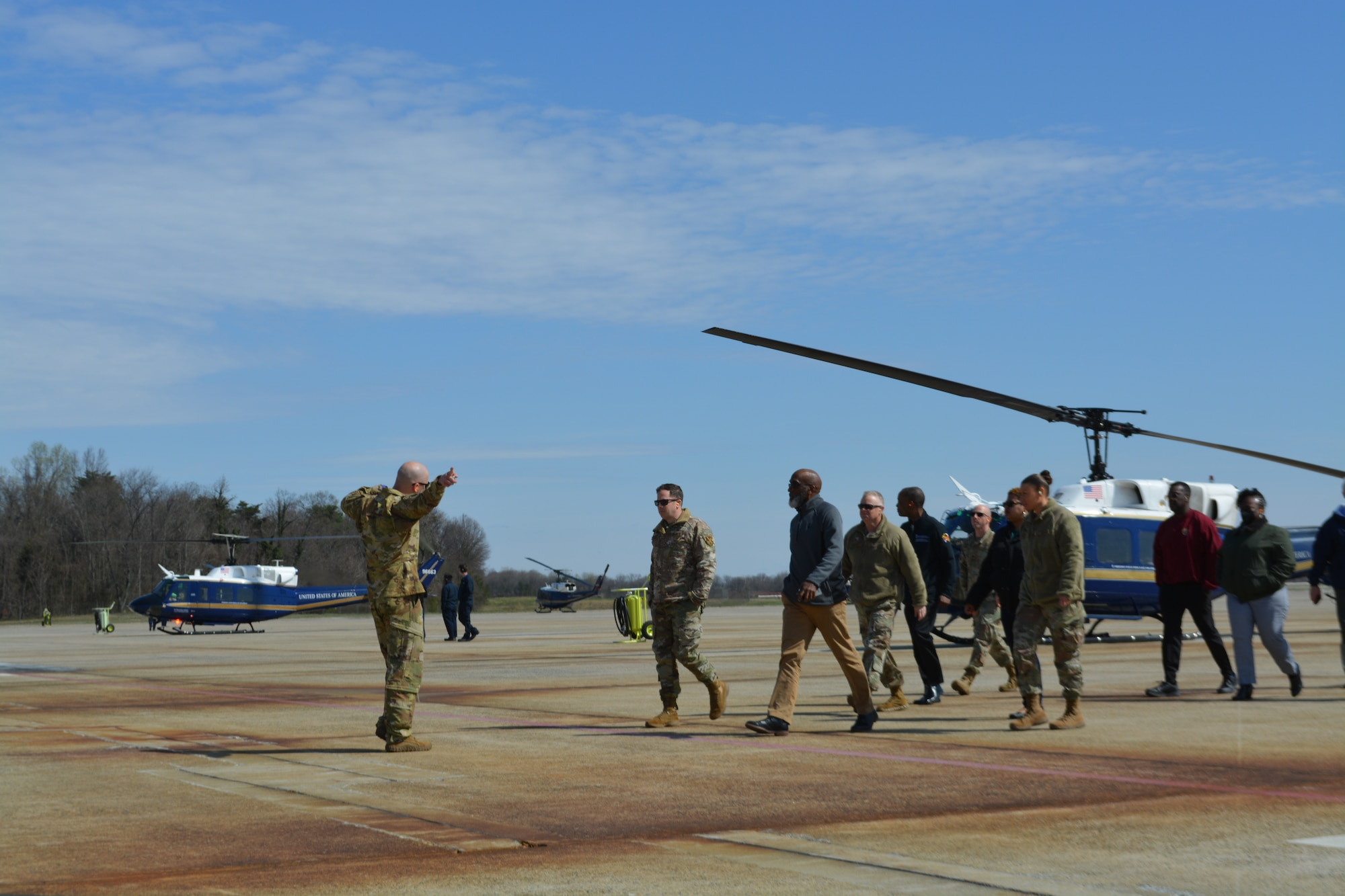 Col. Tyler Schaff, 316th Wing and Joint Base Andrews installation commander, 316th Wing senior leaders, and JBA honorary commanders return from their public affairs flight as they walk on the flightline during the Honorary Commanders Program quarterly visit on Joint Base Andrews, Md., April 4, 2022.