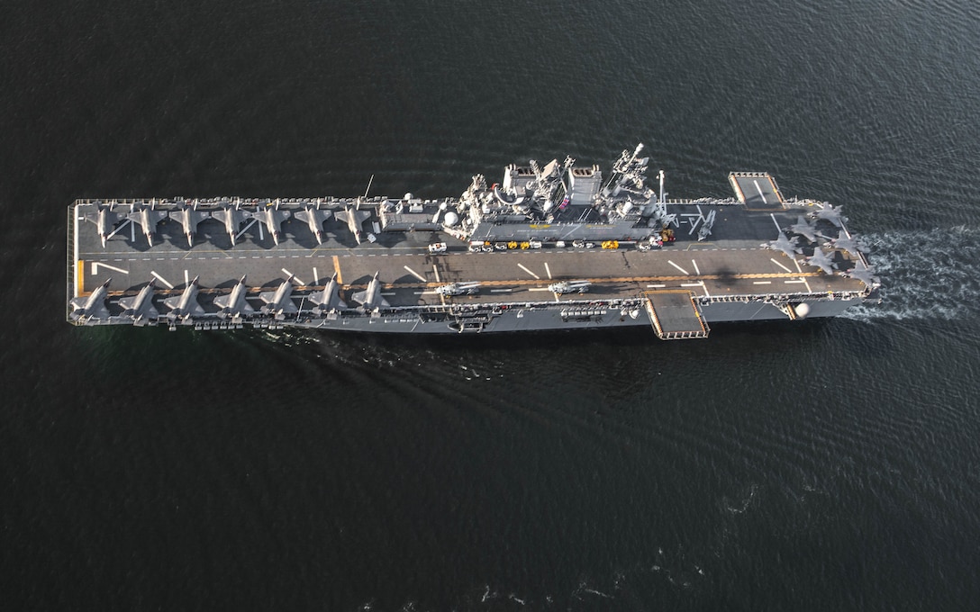 Amphibious assault ship USS Tripoli (LHA- 7) , departs Naval Air Station North Island, Calif., April 7, 2022. Tripoli completed flight deck operations with 20 F-35B Lightning II jets from Marine Fighter Attack Squadrons 211 and 225, Marine Aircraft Group 13, and 3rd Marine Aircraft Wing, as well as Marine Operational Test and Evaluation Squadron 1, as part of the U.S. Marine Corps’ Lightning carrier concept demonstration. The Lightning carrier concept demonstration shows Tripoli and other amphibious assault ships are capable of operating as dedicated fixed-wing strike platforms when needed, capable of bringing fifth generation Short Takeoff/Vertical Landing aircraft wherever they are required. (U.S. Marine Corps photo by Sgt. Samuel Ruiz)