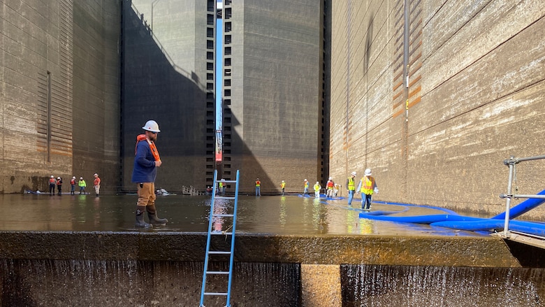 Lockmaster Clay Askew walks along the floor fo the chamber, preparing to take the inspection team inside the main chamber at Wilson Lock on April 7, 2022.