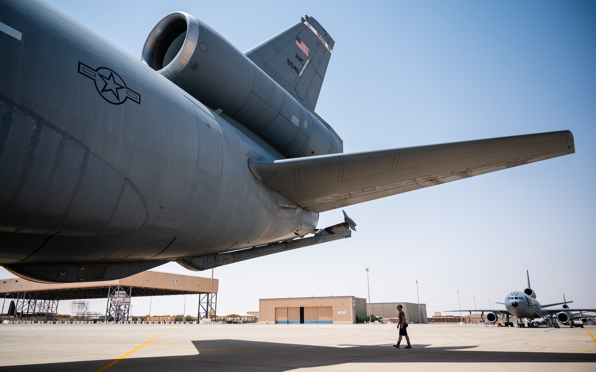 Airman 1st Class Seth Ambos, 908th Expeditionary Air Refueling Squadron crew chief, inspects a KC-10 Extender at Prince Sultan Air Base, Kingdom of Saudi Arabia, April 7, 2022. Airmen of the 908th EARS provide advanced tanker and cargo capabilities and can refuel U.S., ally and partner nation military aircraft. (U.S. Air Force photo by Senior Airman Jacob B. Wrightsman)