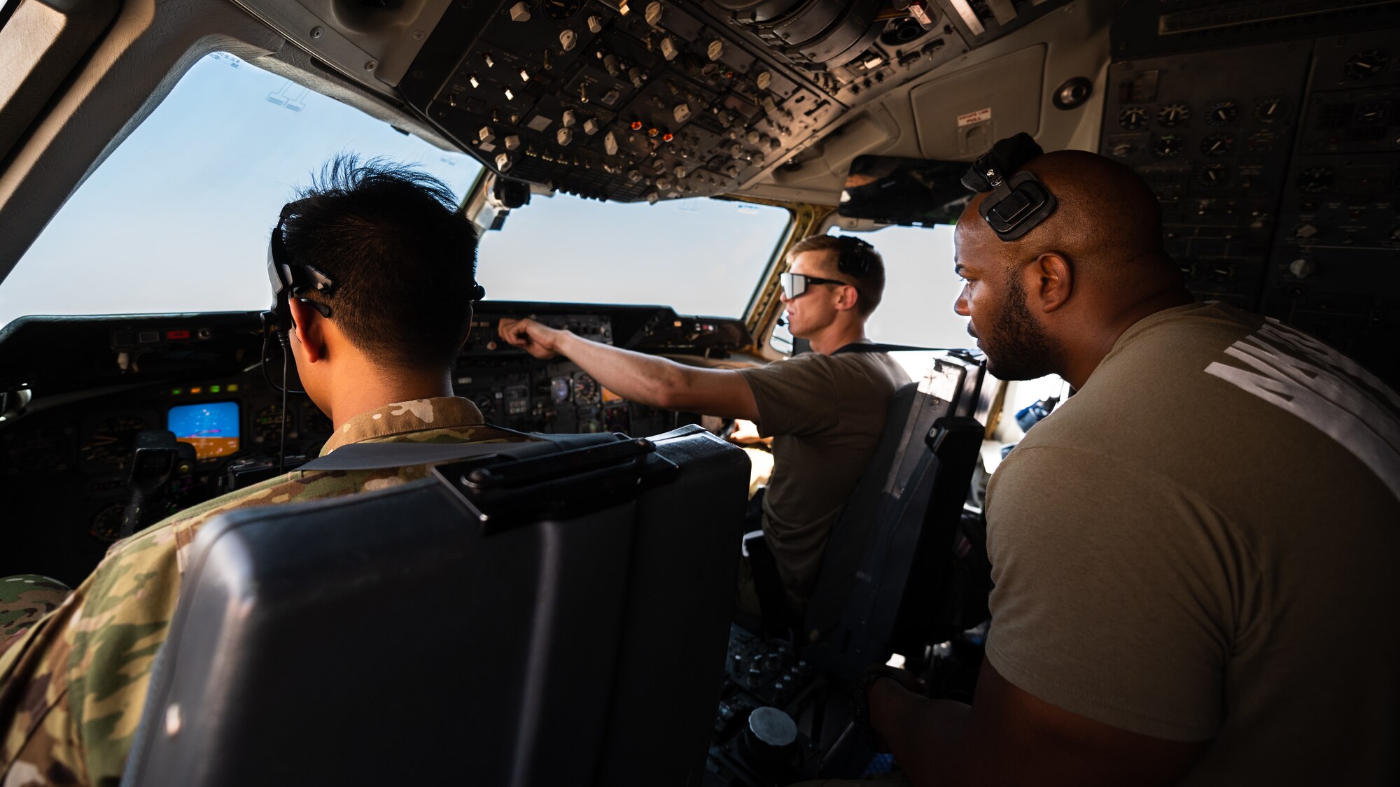 U.S. Air Force Capt. Kevin Cabusora, 908th Expeditionary Air Refueling Squadron aircraft commander, Capt. Gavin Owens 908th EARS instructor pilot, and Tech. Sgt. Justin Lassiter, 908th EARS instructor flight engineer, take off in a KC-10 Extender at Prince Sultan Air Base, Kingdom of Saudi Arabia, April 7, 2022. The crew was composed of Airmen deployed from the 305th Air Mobility Wing, McGuire Air Force Base, New Jersey, to mark the final KC-10 flight by Airmen deployed from McGuire AFB. (U.S. Air Force photo by Senior Airman Jacob B. Wrightsman)