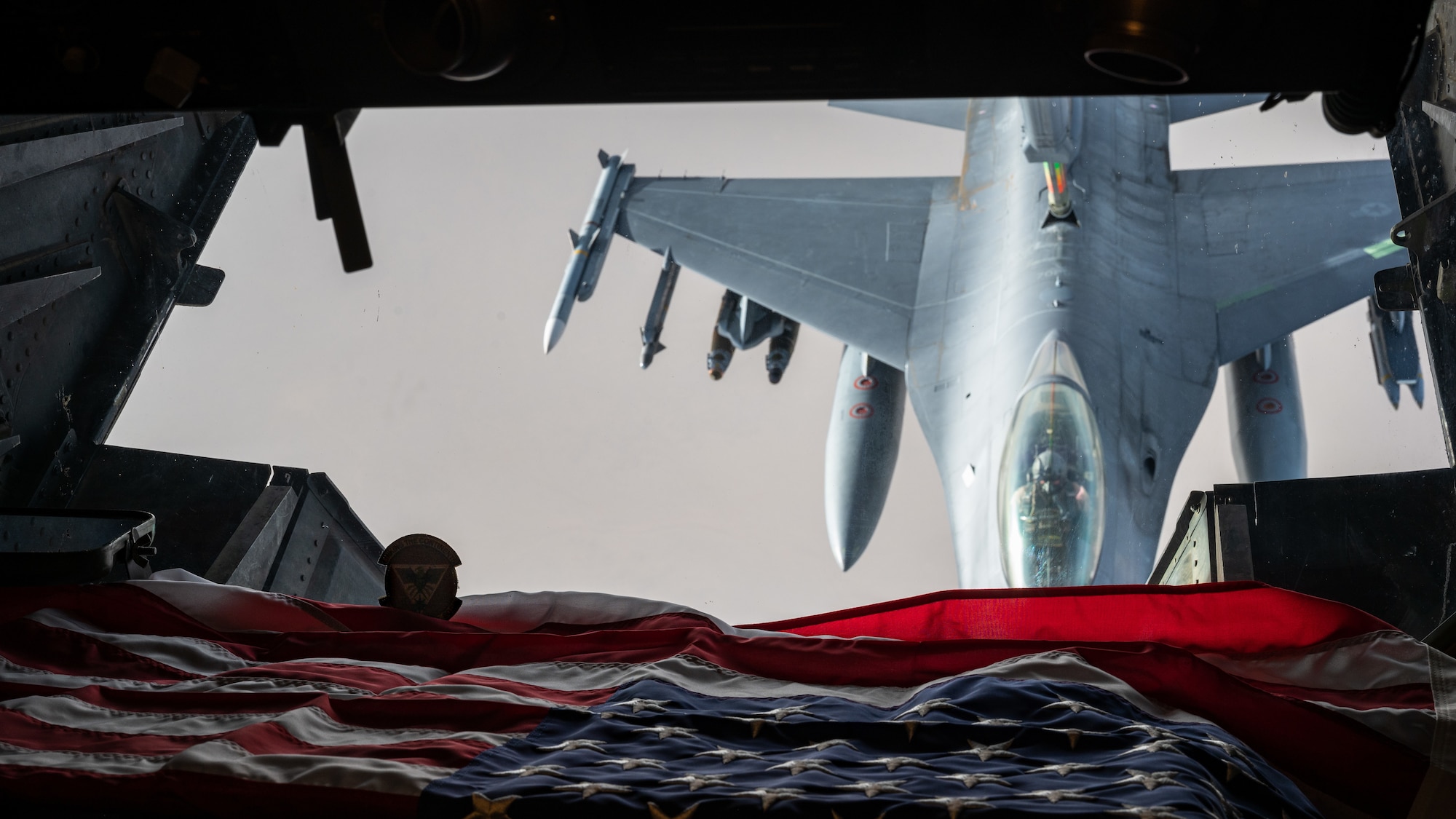 A U.S. Air Force F-16 Fighting Falcon is refueled by a KC-10 Extender over the U.S. Central Command area of responsibility, April 7, 2022. The KC-10 is an advanced tanker and cargo aircraft that delivers Ninth Air Force (Air Forces Central)’s global reach aerial refueling capability to support joint and partner nation aircraft throughout the U.S. Central Command area of responsibility. (U.S. Air Force photo by Senior Airman Jacob B. Wrightsman)