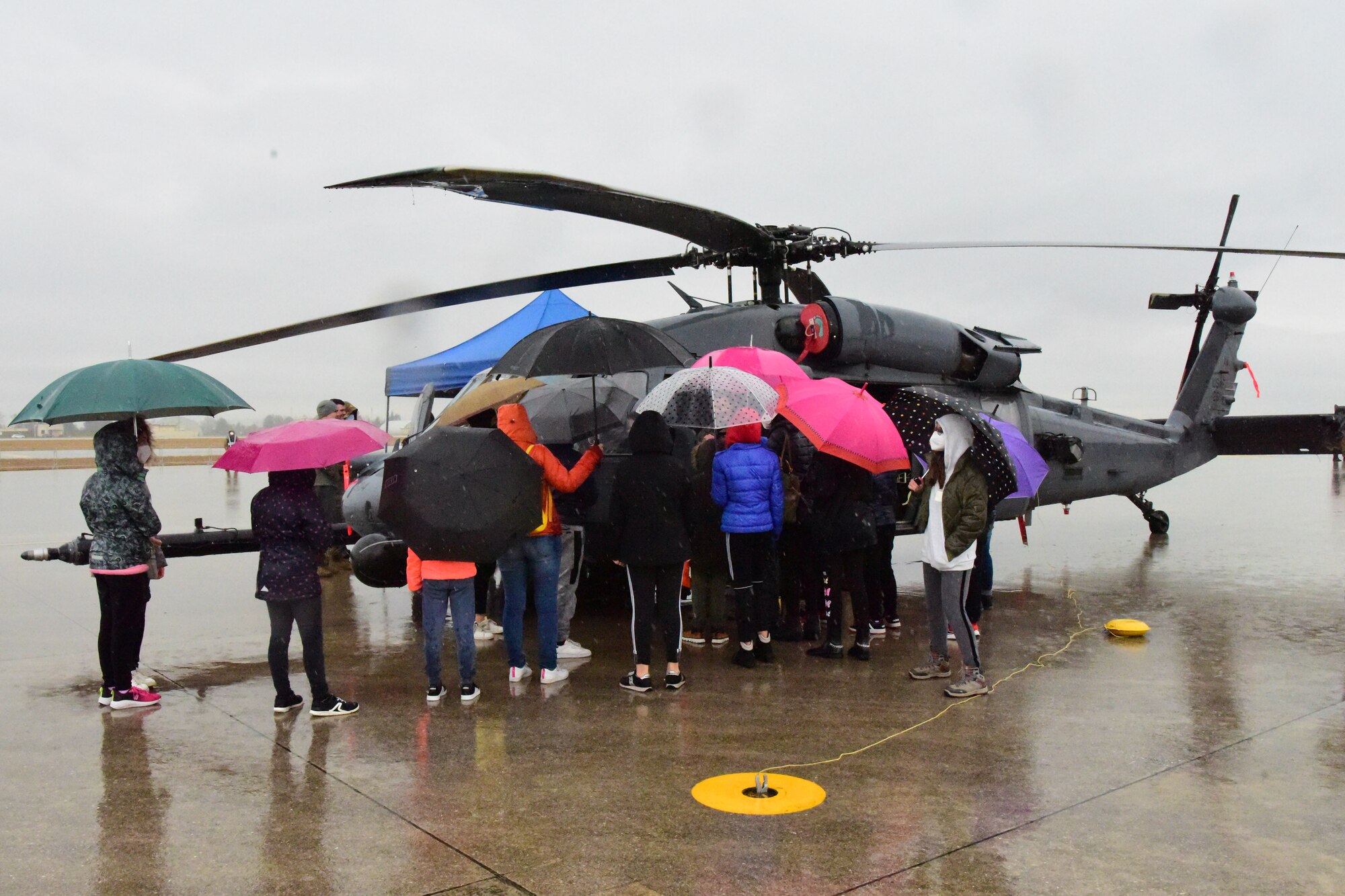 Children view an HH-60G Pavehawk from the 56th Rescue Squadron during an open house at Aviano Air Base, Italy, April 1, 2022. The U.S. Air Force and Italian air force organized the demonstration for military children as well as local community school children in honor of the Month of the Military Child. Students viewed a variety of static displays and the Frecce Tricolori Italian air force aerobatics team performed aerial maneuvers. (U.S. Air Force photo by Senior Airman Jessica Blair)
