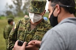 Tech Sgt. Oscar Morales, 7th Explosive Ordnance Disposal Flight, provides field training to Ecuadorian Army soldiers to use new demining equipment Feb. 23, 2022, in Sangolquí, Ecuador. The equipment, from U.S. Southern Command, will be used to help clear the last remaining part of the country's southern border so it can be returned to the local population for farming and other activities.