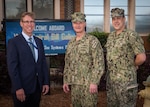 (left) Dr. Peter Adair, Naval Surface Warfare Center Panama City Division technical director, and (right) Capt. David Back, NSWC PCD commanding officer welcome Commander of Naval Sea Systems Command (NAVSEA), Vice Adm. Bill Galinis during his visit, March 30. Galinis experienced Panama City’s reputation as the home of military diving through presentations of diving systems NSWC PCD develops and supports for Naval Special Warfare, Explosive Ordnance Disposal, Specialized Research Diving Detachment, Special Operations Command, and Navy Diving. (U.S. Navy photo by Eddie Green)