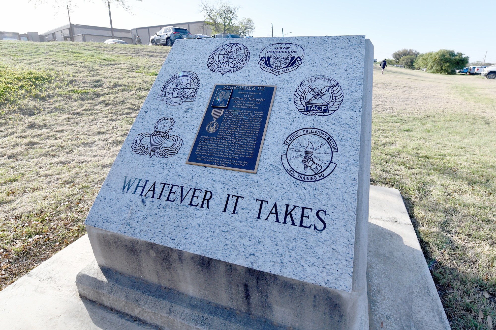 The newly refitted memorial for U.S. Air Force Lt. Col. William Schroeder at the Special Warfare Training Wing training compound Joint Base San Antonio, Chapman Training Annex, Apr. 8, 2022. The wing and echelon units hosted a two and one-half mile ruck march followed by Memorial pushups and the unveiling of refitted memorials in coordination with Gold Star families (U.S. Air Force photo by Brian Boisvert)