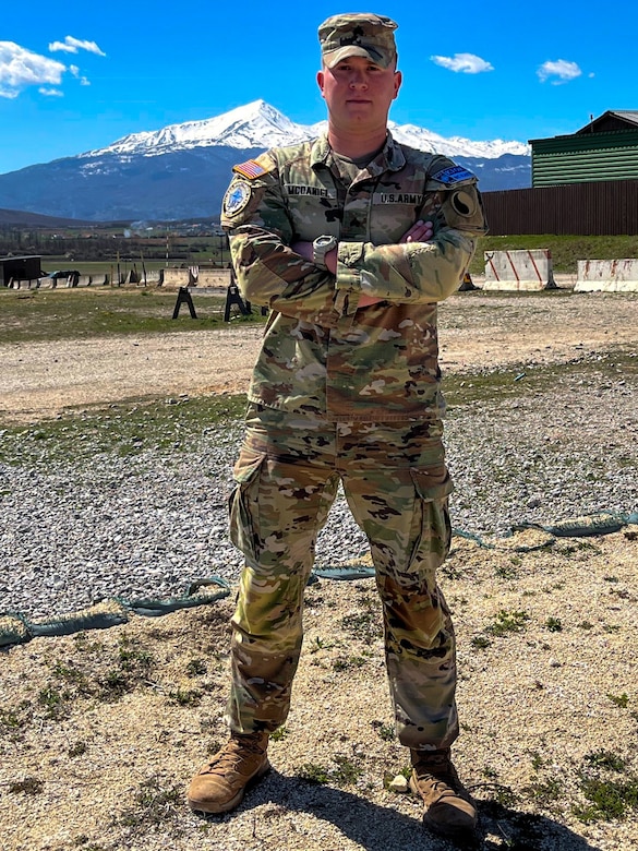 U.S. Army Sgt. Jessey McDaniel, an infantryman with Delta Company, 1st Battalion, 149th Infantry Regiment, 116th Infantry Brigade Combat Team, Kentucky National Guard, and member of one of Kosovo Force's Liaison Monitoring Teams, poses for a photograph at Camp Bondsteel, Kosovo, April 8, 2022. McDaniel, a native of Lexington, Ky., is part of the U.S.'s 30th rotation of the KFOR mission, which is committed to maintaining a safe and secure environment and freedom of movement for all people of Kosovo.  (U.S. Army photo by Sgt. Alexander Hellmann 1-149 INF)