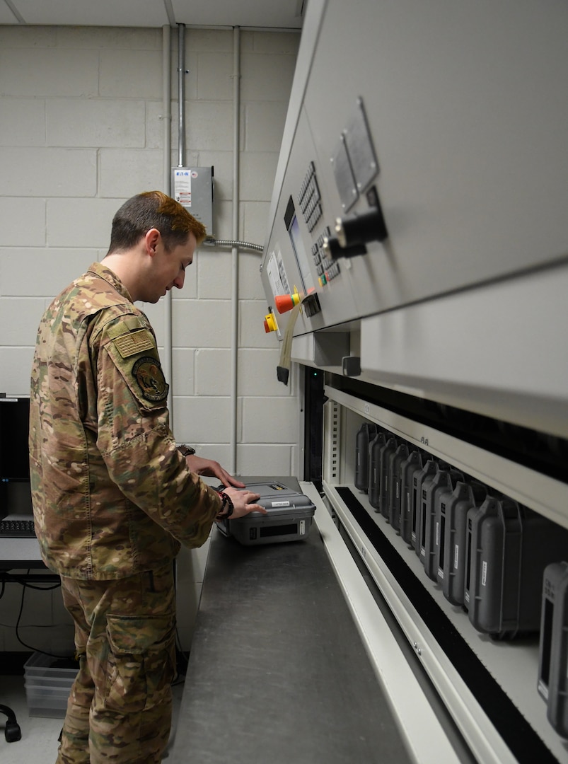 Technical Sgt. Edward Armit, 920th Operations Support Squadron aircrew flight equipment craftsman, examines night vision goggle inventory on the lean lift machine at Patrick Space Force Base, Fla., April 02, 2022. AFE is a team of 27 Airmen whose main role is to maintain, test, and inspect the flight gear used by all aircrew. (U.S. Air Force photo by Staff Sgt. Darius Sostre-Miroir)