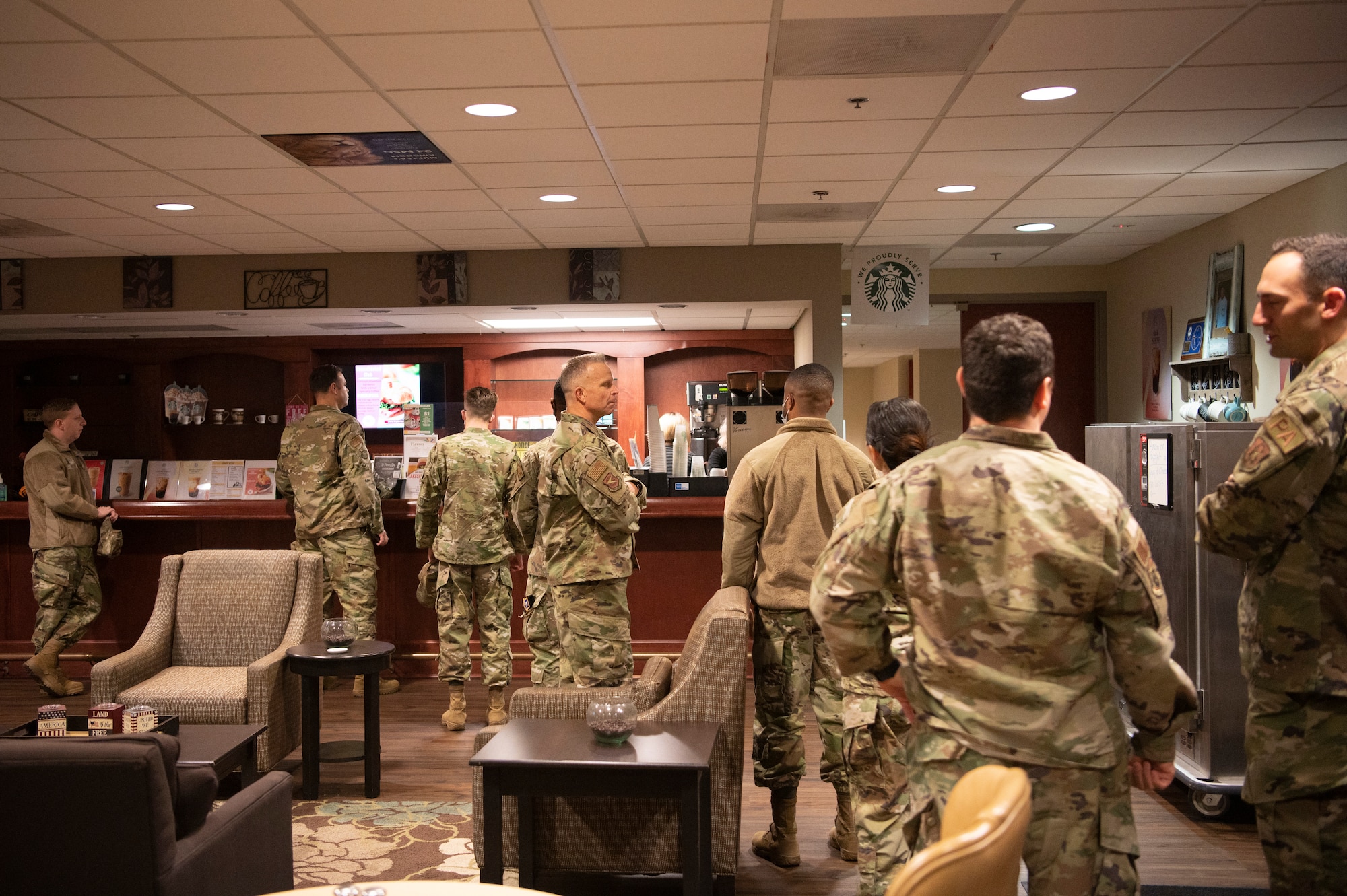 Airmen from the 94th Airlift Wing line up for coffee at the Dobbins Consolidated Club at Dobbins Air Reserve Base, March 5, 2022. The Dobbins Consolidated Club provides a variety of food services throughout the week and the UTA weekend. (U.S. Air Force Photo by Senior Airman Kendra A. Ransum)