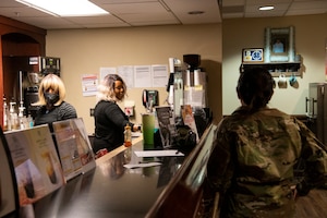 Sarah Gauthier, a cashier, and Mary Celano, a barista, brew coffee at the Consolidated Club on Dobbins Air Reserve Base, March 5, 2022. The Dobbins Consolidated Club provides a variety of food services throughout the week and the UTA weekend. (U.S. Air Force Photo by Senior Airman Kendra A. Ransum)