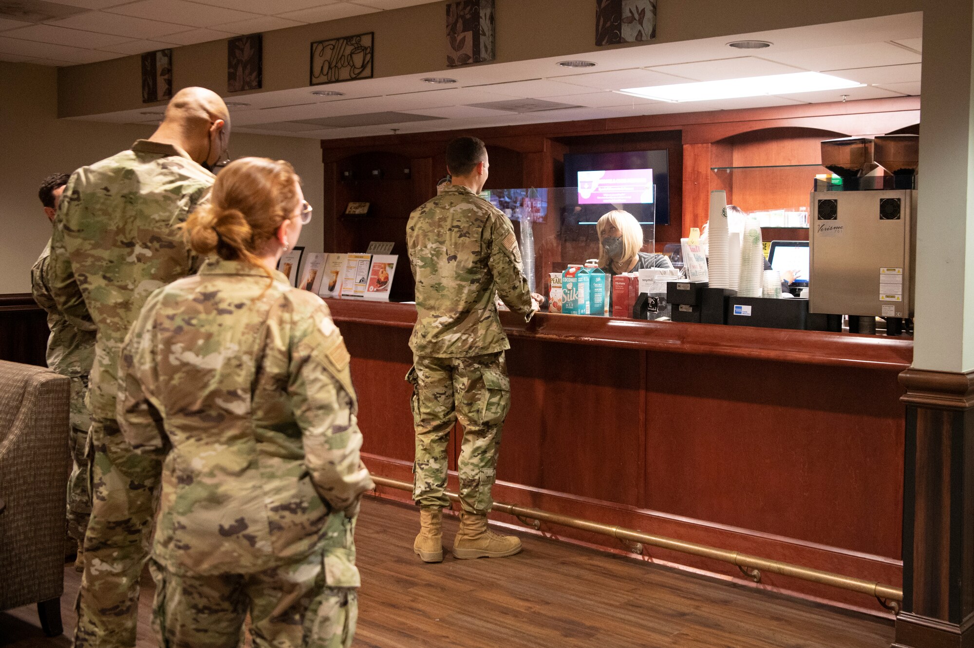 Mary Celano, a barista, takes an Airman's order at the Consolidated Club on Dobbins Air Reserve Base, March 5, 2022. The Dobbins Consolidated Club provides a variety of food services throughout the week and the UTA weekend. (U.S. Air Force Photo by Senior Airman Kendra A. Ransum)