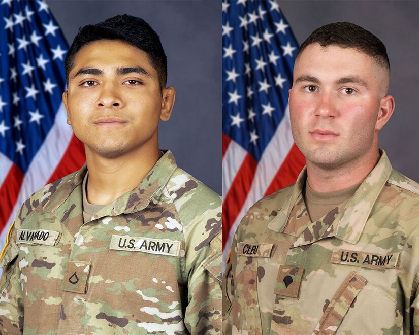 Two soldiers pose for a photo.