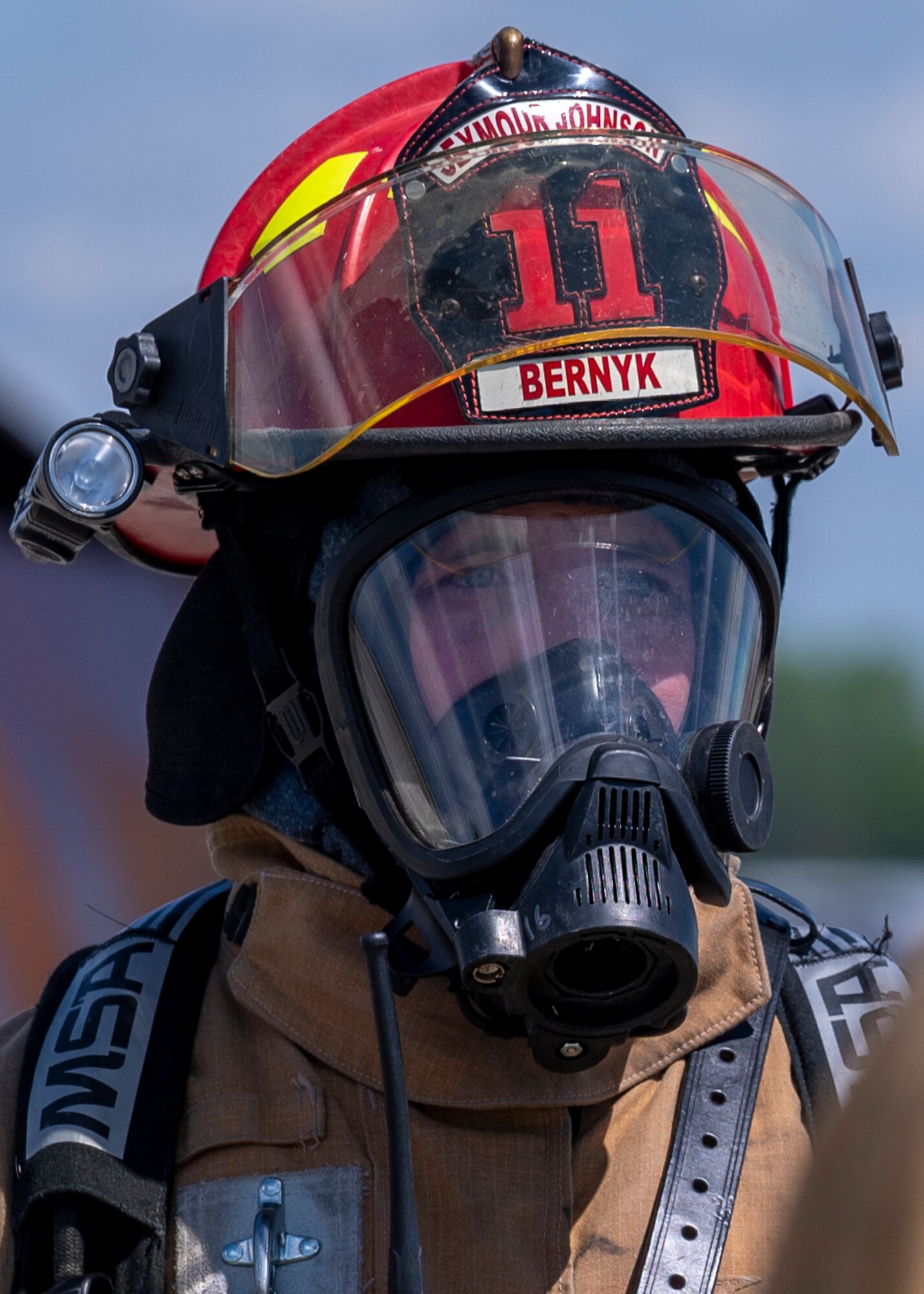Tech. Sgt. Erik Bernyk, 4th Civil Engineer Squadron firefighter, suits up into his protective gear prior to participating in controlled aircraft fire training at Seymour Johnson Air Force Base, North Carolina, April 8, 2022.