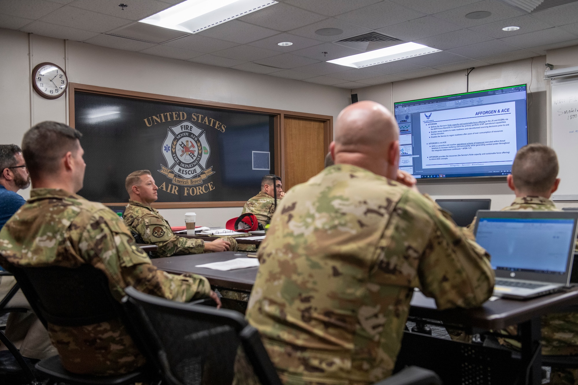 U.S. Air Force fire protection leaders review slides during a career field conference at Moody Air Force Base, Georgia, March 8, 2022. Fire and Emergency Services leaders from across the Air Force combined their knowledge to define and reshape the way their Airmen and assets deploy. (U.S. Air Force photo by Airman 1st Class Deanna Muir)