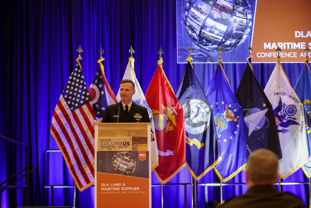 Man in uniform at a podium
