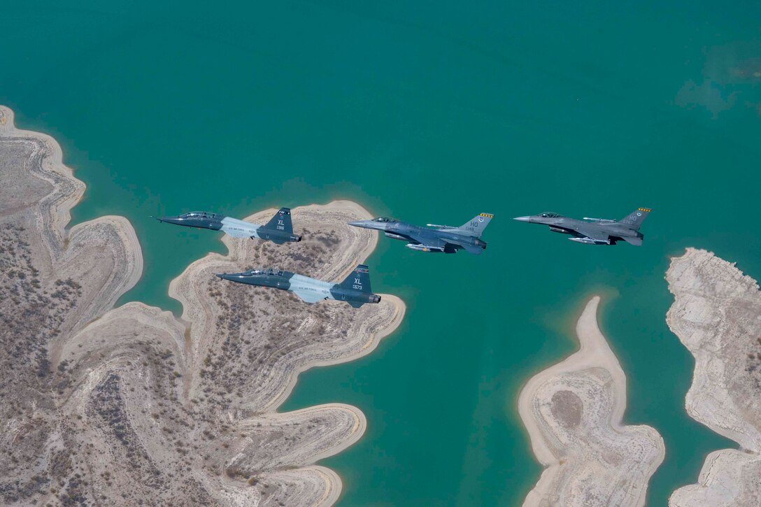 Four aircraft fly in formation.