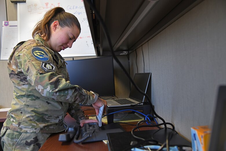 SCHRIEVER SPACE FORCE BASE, Colo. – U.S. Space Force Spc. 4 Aileen Ocampo, 50th Communications Squadron network infrastructure technician, sets up a Voice over Internet Protocol telephone at Schriever Space Force Base, April 11, 2022. The SSFB VoIP project’s goal is to replace all of the existing phones on the base with more modern phones that include digital displays. (U.S. Space Force photo by Airman 1st Class Aaron Edwards)