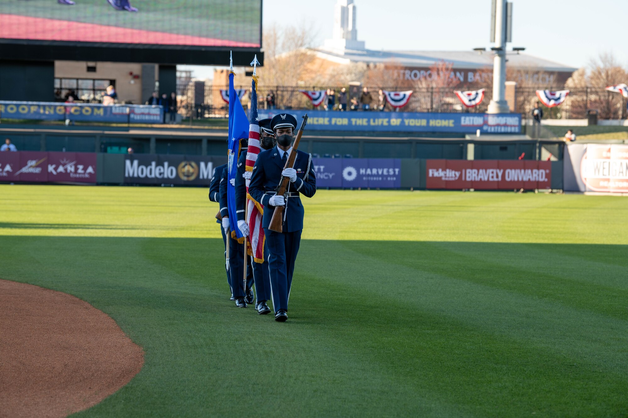 Honor Guardsmen from the 22nd Air Refueling Wing, perform a National Anthem presentation of the colors at a Wichita Wind Surge game April 8, 2022, at Riverfront Stadium in Wichita,