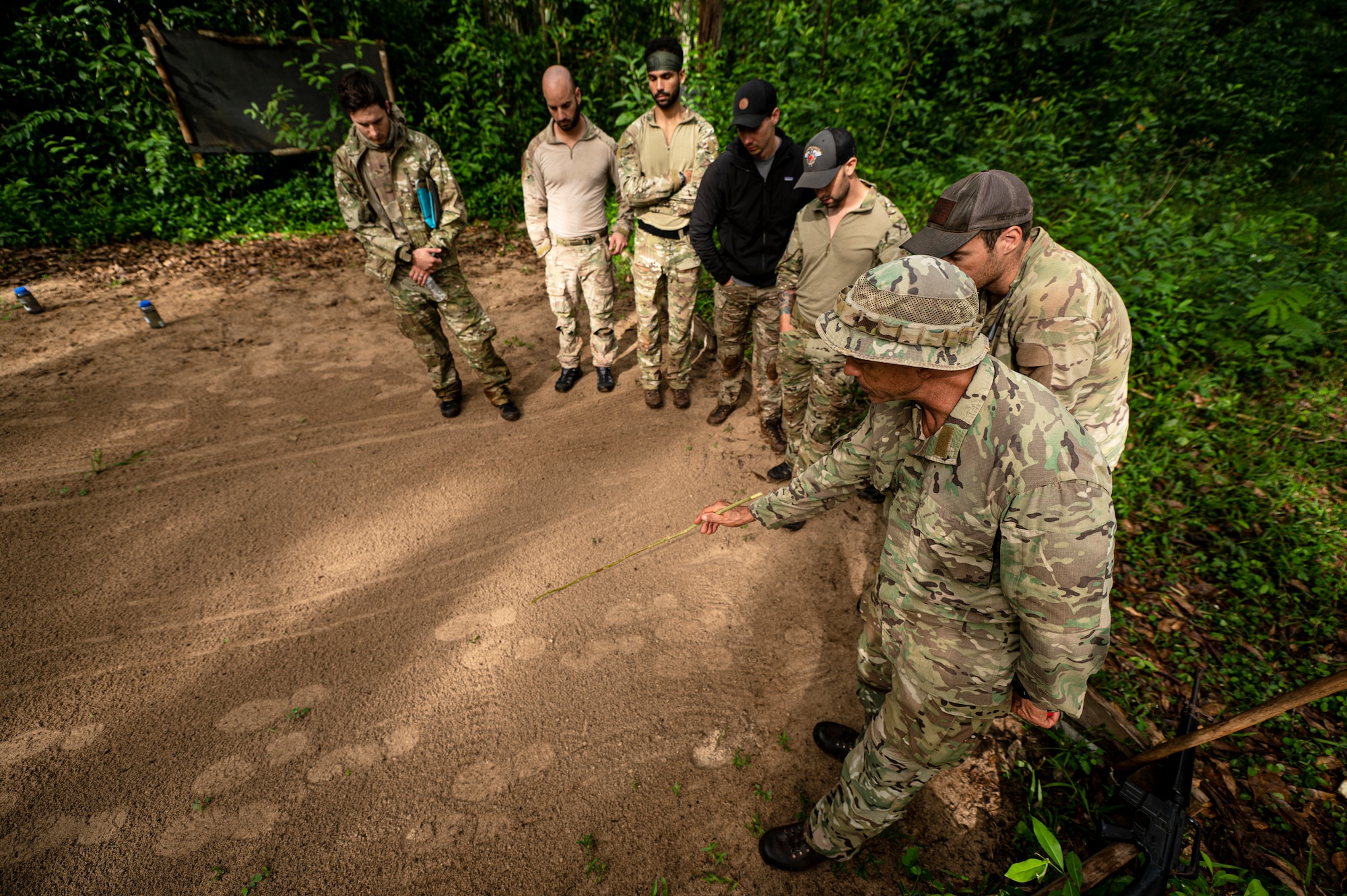 Photo of Airmen and instructors talking