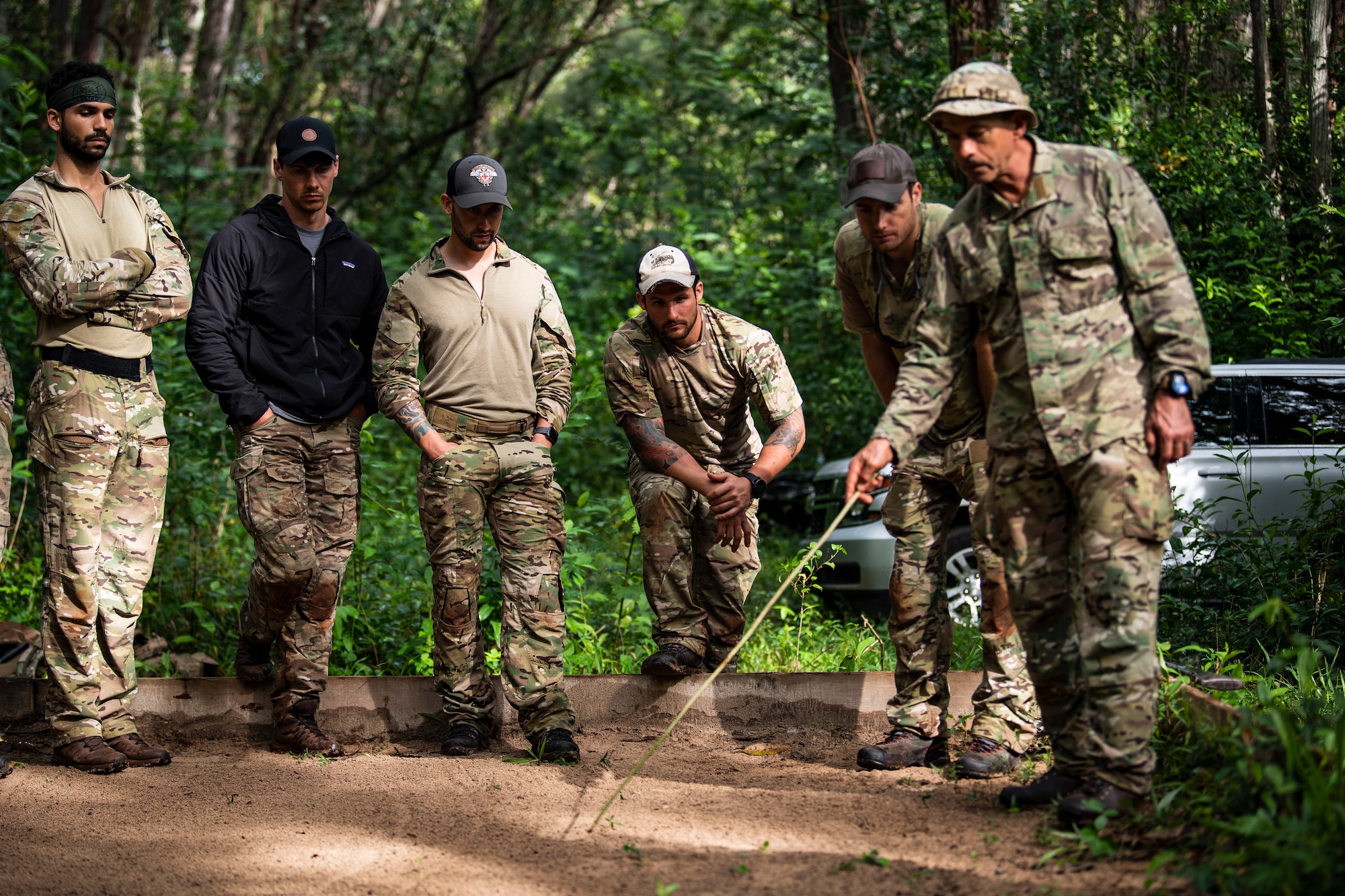 Photo of Airmen and instructors talking