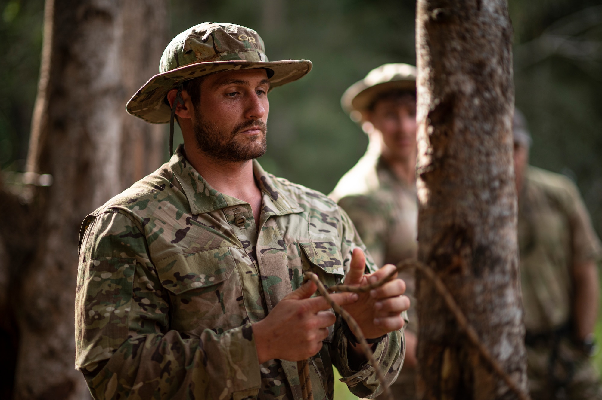 Photo of Airman tying rope