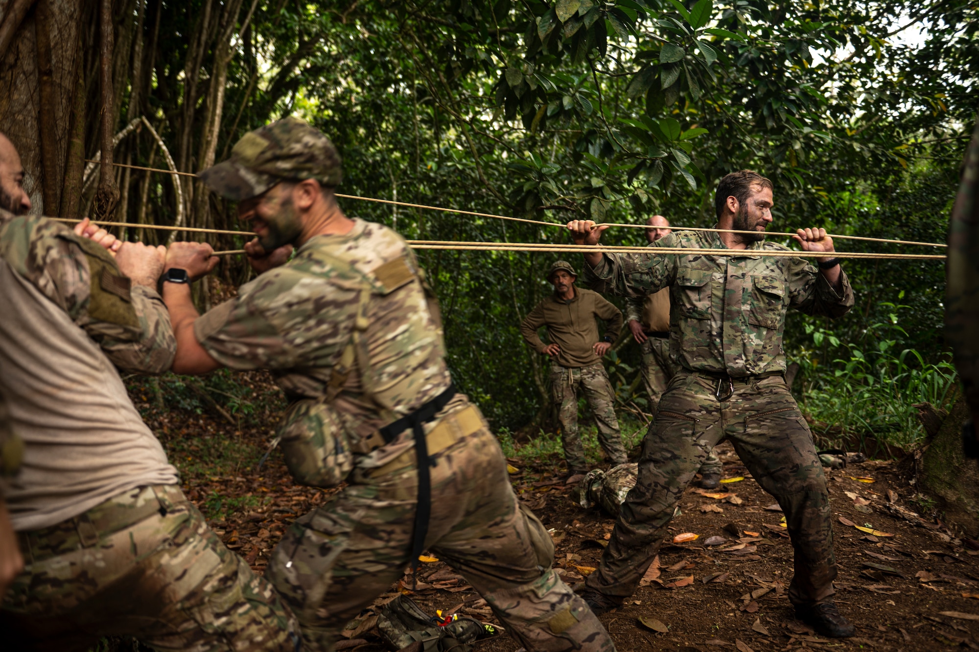 Photo of Airmen tying off a rope bridge