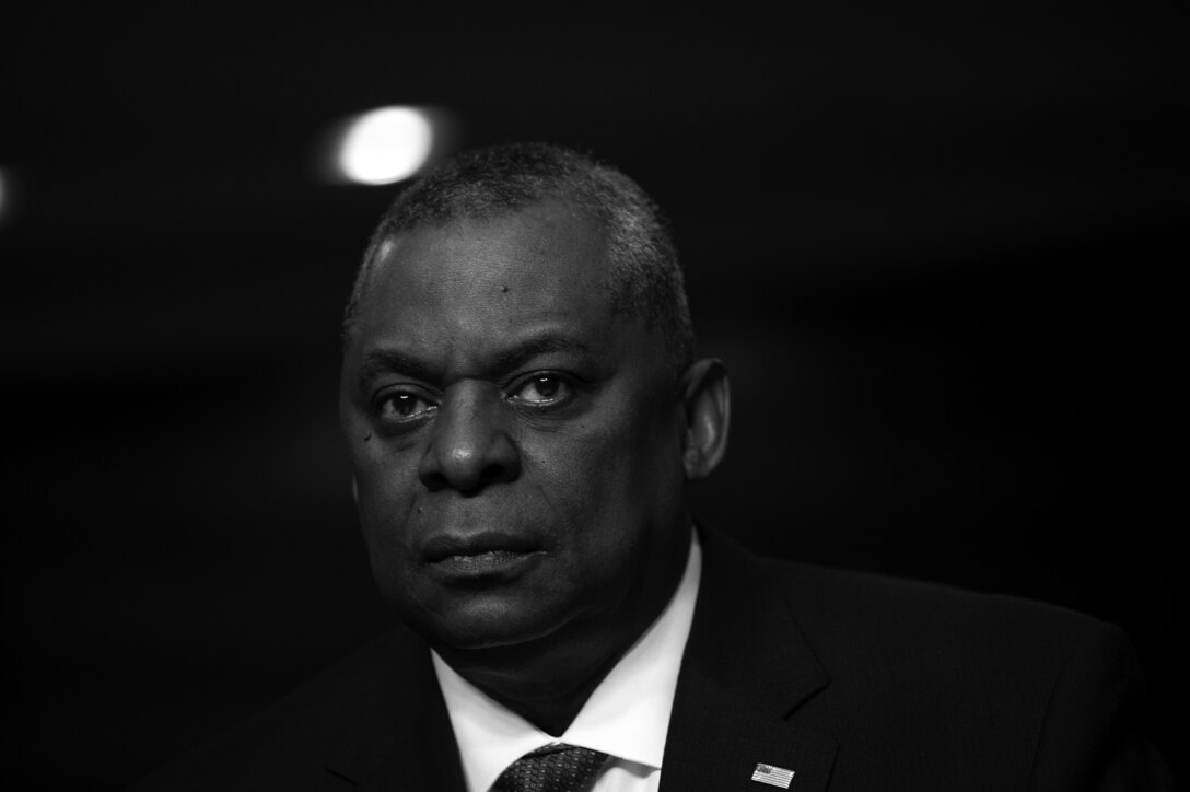 Secretary of Defense Lloyd J. Austin III, seen in black and white, speaks before the Senate.
