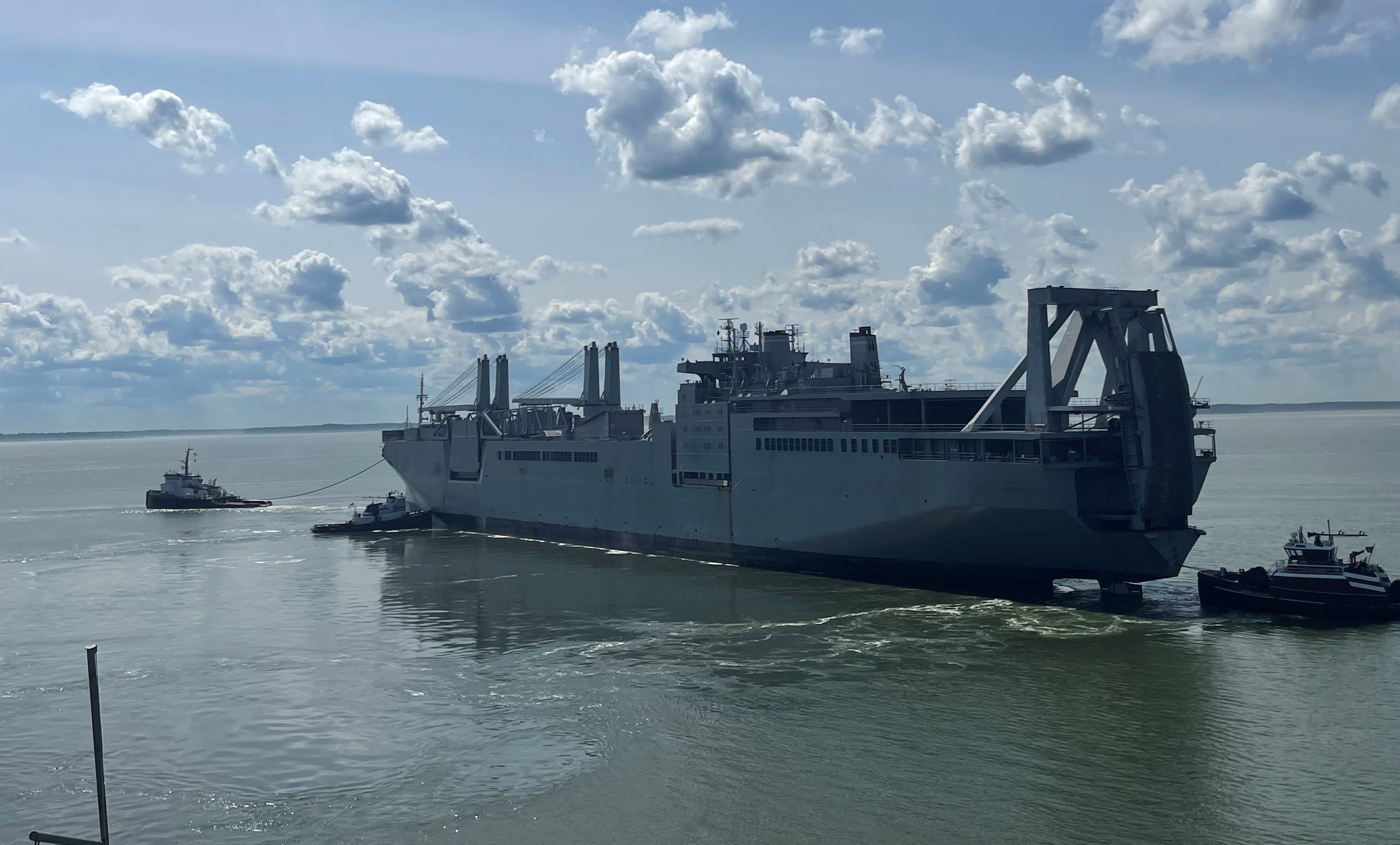 Military Sealift Command chartered tugboat Signet Warhorse I to tow the Large, Medium-Speed, Roll-on/Roll-off (LSMR) ship USNS Shughart (T-AKR 295) from Newport News Marine Terminal