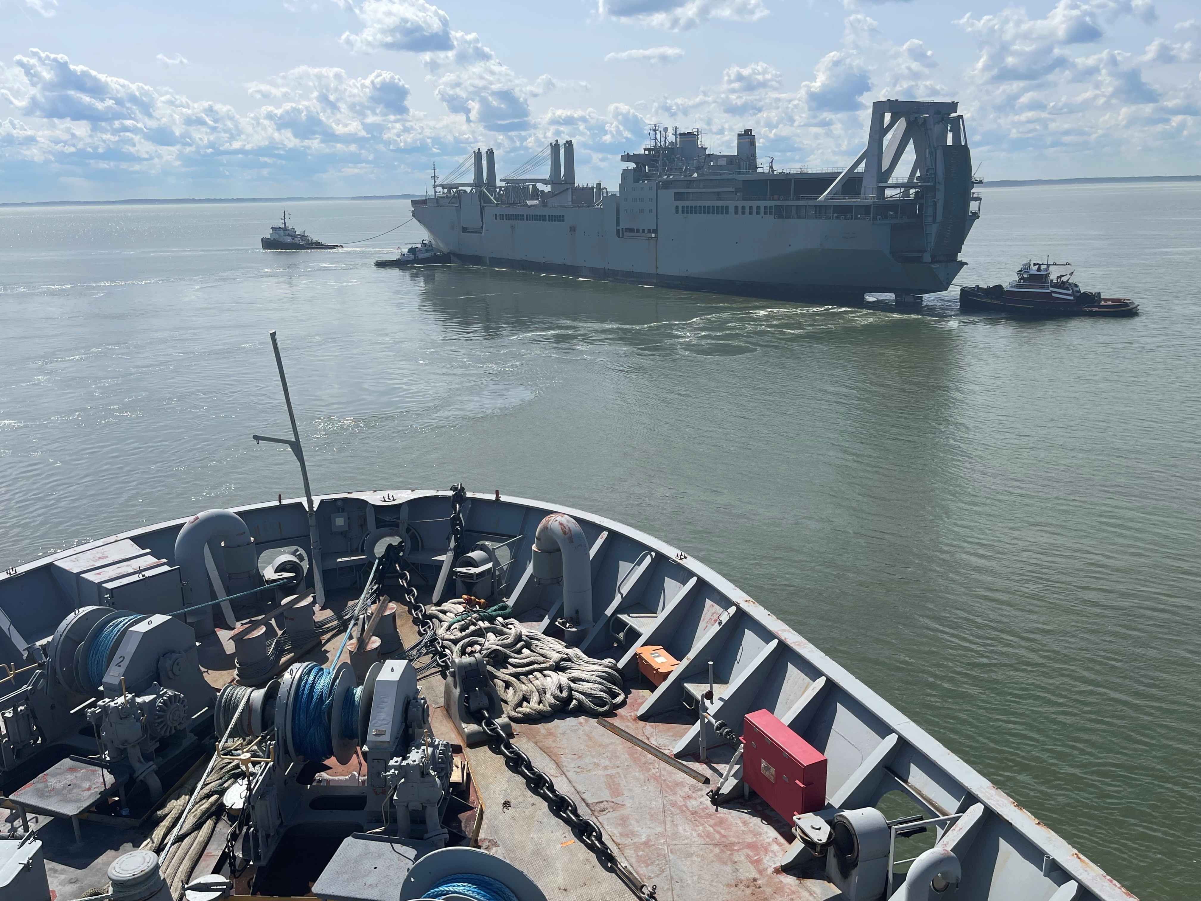 Military Sealift Command chartered tugboat Signet Warhorse I to tow Large, Medium-Speed, Roll-on/Roll-off (LMSR) ship USNS Shughart (T-AKR 295) from Newport News Marine Terminal