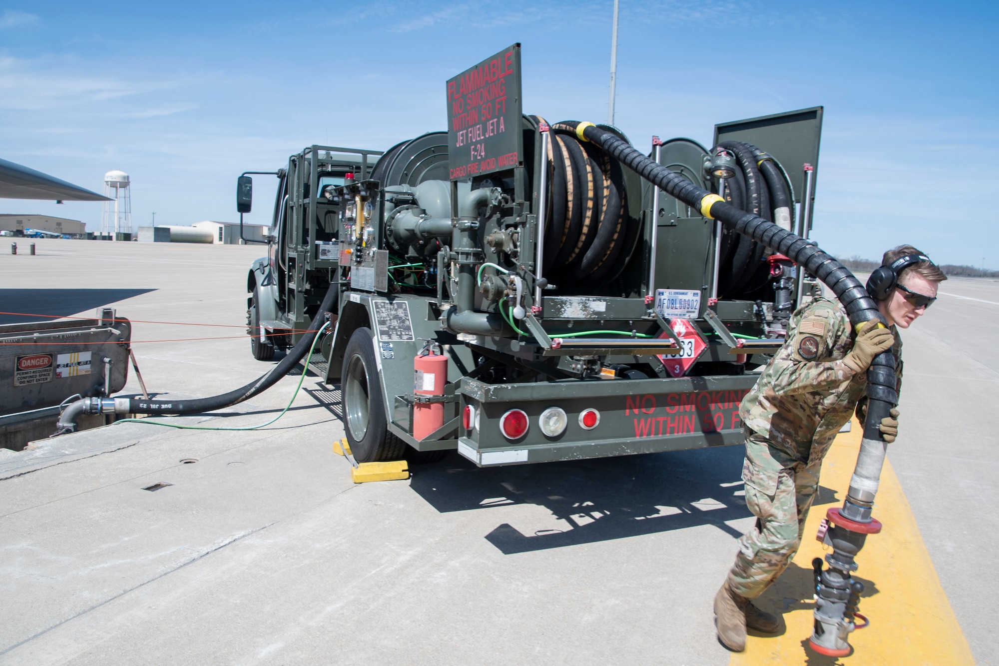 Senior Airman Bailey Shuff of the 509th Logistics Readiness Squadron, operates a refueling truck during a hot-pit refuel of a B-2 Spirit stealth bomber during Exercise Agile Tiger on Whiteman Air Force Base, Missouri, April 4, 2022. Exercise Agile Tiger was a 509th-led interoperability training exercise which combined and honed the skills of active duty, guard, and reserve U.S. Military Forces to ensure combat-readiness. (U.S. Air National Guard photo by Airman 1st Class Kelly C. Ferguson)