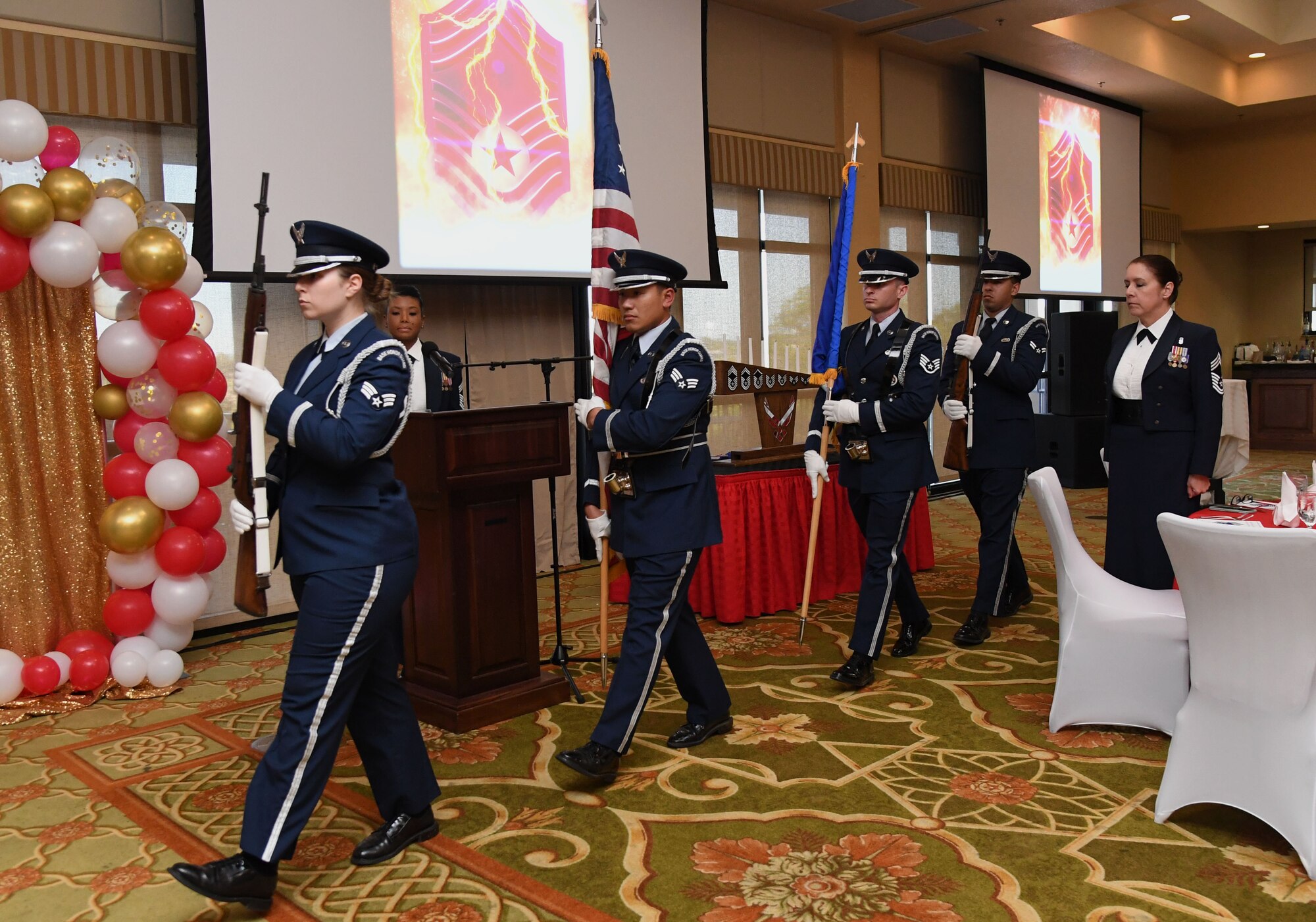 Members of the Keesler Honor Guard present the colors during the Chief Master Sergeant Recognition Ceremony inside the Bay Breeze Event Center at Keesler Air Force Base, Mississippi, April 8, 2022. Four Keesler Airmen earned their chief master sergeant stripe during the 2022 promotion release. Chief master sergeants make up one percent of the Air Force enlisted force. (U.S. Air Force photo by Kemberly Groue)