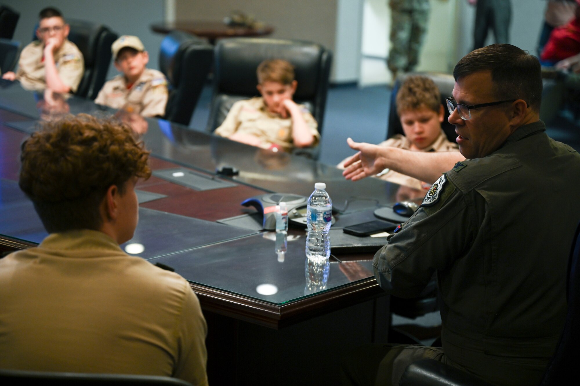 Col. Nicholas Pederson, 49th Wing vice commander, educates Scout Troop BSA 4434 on the MQ-9 Reaper and how it works, April 22, 2022 on Holloman Air Force Base, New Mexico. Troop BSA 4434 traveled from Duncan, Oklahoma, to tour Holloman and learn more about our mission here. (U.S. Air Force photo by Airman 1st Class Antonio Salfran)