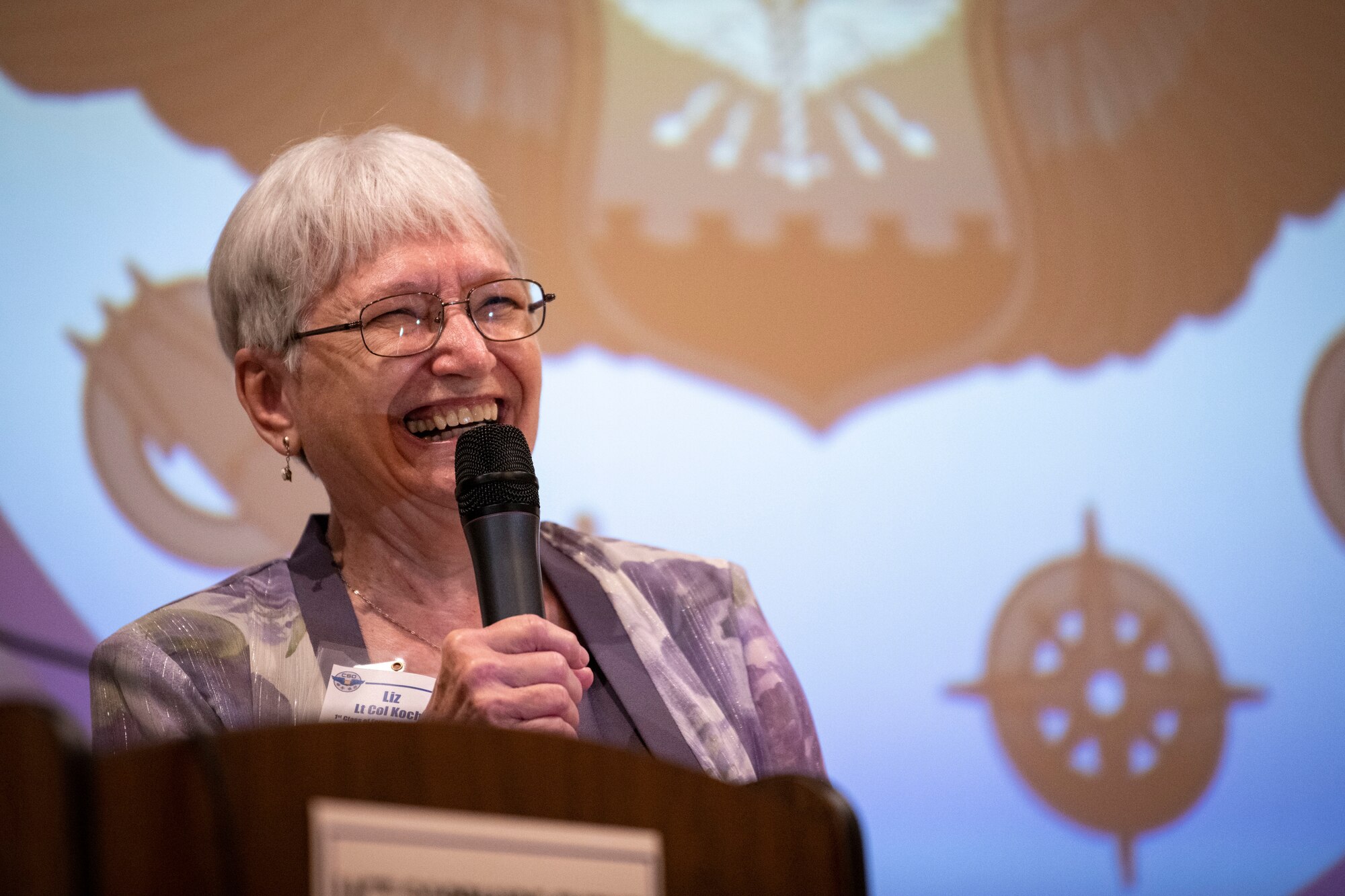 Lt. Col. (Ret.) Elizabeth Koch spoke to a gathering of fellow members of UNT 78-01 and their successors at NAS Pensacola during a celebration of their barrier breaking feat.