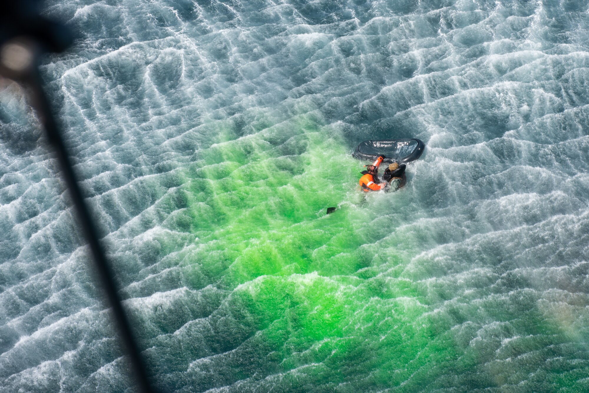 Naval Aircrewman (Helicopter) 1st Class Joshua Armitage, Helicopter Sea Combat Squadron 85 rescue swimmer, performs an open-sea rescue on Staff Sgt. Ahron Rasabi, 51st Operations Support Squadron survival, evasion, resistance and escape specialist, during a combat search and rescue training event April 8, 2022 over the Pacific Ocean.