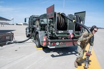 Senior Airman Bailey Shuff of the 509th Logistics Readiness Squadron, operates a refueling truck during a hot-pit refuel of a B-2 Spirit stealth bomber during Exercise Agile Tiger on Whiteman Air Force Base, Missouri, April 4, 2022. Exercise Agile Tiger was a 509th-led interoperability training exercise which combined and honed the skills of active duty, guard, and reserve U.S. Military Forces to ensure combat-readiness. (U.S. Air National Guard photo by Airman 1st Class Kelly C. Ferguson)