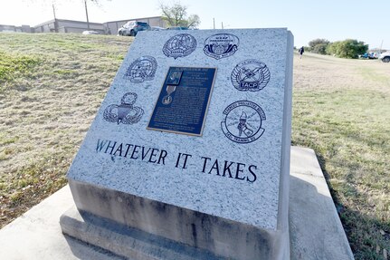 The newly refitted memorial for U.S. Air Force Lt. Col. William Schroeder at the Special Warfare Training Wing training compound Joint Base San Antonio, Chapman Training Annex, Apr. 8, 2022. The wing and echelon units hosted a two and one-half mile ruck march followed by Memorial pushups and the unveiling of refitted memorials in coordination with Gold Star families (U.S. Air Force photo by Brian Boisvert)