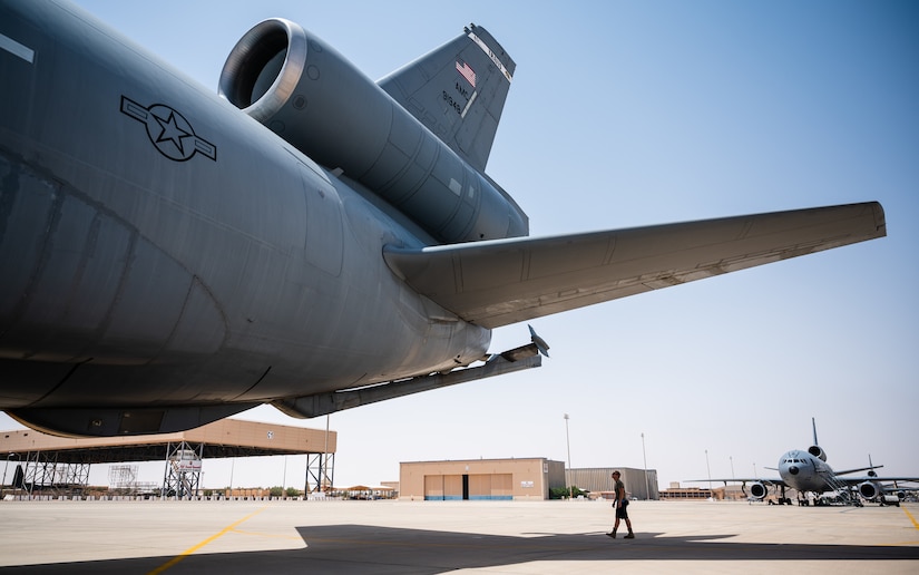 Airman 1st Class Seth Ambos, 908th Expeditionary Air Refueling Squadron crew chief, inspects a KC-10 Extender at Prince Sultan Air Base, Kingdom of Saudi Arabia, April 7, 2022. Airmen of the 908th EARS provide advanced tanker and cargo capabilities and can refuel U.S., ally and partner nation military aircraft. (U.S. Air Force photo by Senior Airman Jacob B. Wrightsman)