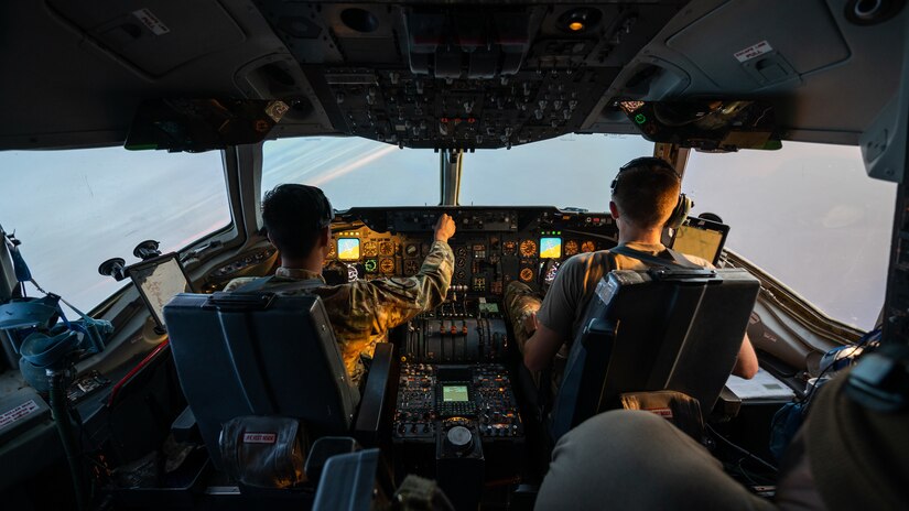 U.S. Air Force Capt. Kevin Cabusora, 908th Expeditionary Air Refueling Squadron aircraft commander and Capt. Gavin Owens, 908th EARS instructor pilot, fly a KC-10 Extender air-refueling sortie over the U.S. Central Command area of responsibility, April 7, 2022. The sortie marked the last KC-10 flight flown by a crew deployed from McGuire Air Force Base, New Jersey. McGuire AFB will cease KC-10 deployments as the base is transitioning to fly the KC-46 Pegasus. (U.S. Air Force photo by Senior Airman Jacob B. Wrightsman)
