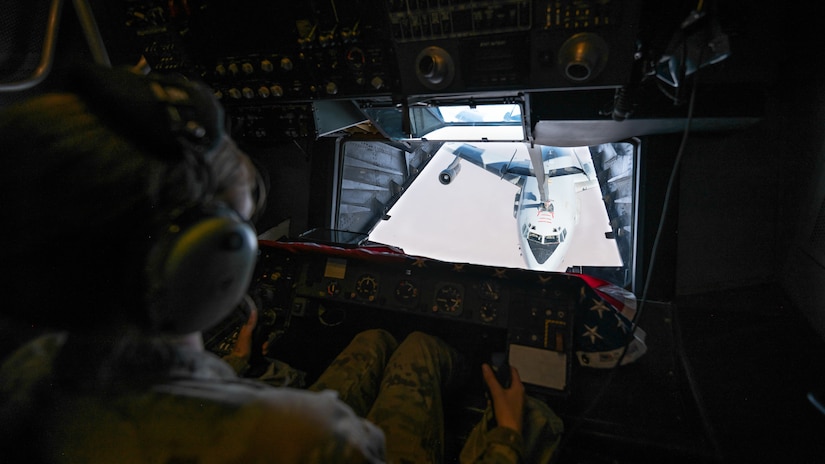 U.S. Air Force Airman 1st Class Lauren Hotaling, 908th Expeditionary Air Refueling Squadron in-flight refueling specialist, refuels an E-3 Sentry over the U.S. Central Command area of responsibility, April 7, 2022. Hotaling and the rest of the crew were the last KC-10 crew deployed from McGuire Air Force Base, New Jersey, to fly a deployed, air-refueling sortie. As McGuire AFB transitions to the KC-46 Pegasus, no more KC-10 crews will be deployed from the base.  (U.S. Air Force photo by Senior Airman Jacob B. Wrightsman)